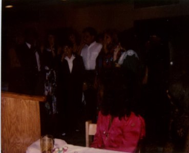 A dark pic of the Band playing their Kazoos in concert.